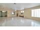 Spacious living room with tile flooring, and sliding glass door access at 9614 Orchard Oasis Ct, Las Vegas, NV 89147