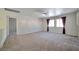 Large living room with ceiling fan, recessed lighting, and carpeting at 9614 Orchard Oasis Ct, Las Vegas, NV 89147