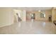 Expansive living area with tile flooring and stairway leading to the upper level at 9614 Orchard Oasis Ct, Las Vegas, NV 89147