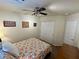 Comfortable bedroom with ceiling fan and floral bedding at 1011 Pecos River Ave, Henderson, NV 89002