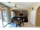 Open concept dining area with chandelier and access to the backyard at 1011 Pecos River Ave, Henderson, NV 89002