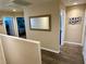 Bright hallway with hardwood floors leading to bedrooms upstairs at 1011 Pecos River Ave, Henderson, NV 89002
