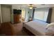Spacious main bedroom with ensuite bathroom, lots of natural light, and ceiling fan at 1011 Pecos River Ave, Henderson, NV 89002