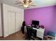 Bedroom/office featuring a computer desk, closet, and ceiling fan at 1011 Pecos River Ave, Henderson, NV 89002