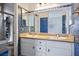 Charming bathroom with double sinks, shower, and blue mosaic tiles at 10513 Shanna Trellis Ave, Las Vegas, NV 89144
