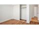 Neat bedroom featuring wood floors and closet with sliding doors at 10513 Shanna Trellis Ave, Las Vegas, NV 89144
