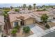Inviting single-story home with tile roof, desert landscaping, and a spacious driveway leading to a two-car garage at 10513 Shanna Trellis Ave, Las Vegas, NV 89144
