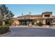 Inviting exterior of a commercial building featuring desert landscaping, ample parking, and architectural details at 10513 Shanna Trellis Ave, Las Vegas, NV 89144