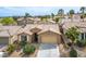 Charming single-story home featuring a tile roof, desert landscaping, and an attached two-car garage at 10513 Shanna Trellis Ave, Las Vegas, NV 89144
