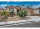 Single-story residence with a two-car garage and desert-friendly landscaping in a sunny setting at 10513 Shanna Trellis Ave, Las Vegas, NV 89144