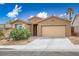Charming single-story home showcasing desert landscaping and a two-car garage under a bright blue sky at 10513 Shanna Trellis Ave, Las Vegas, NV 89144