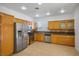 Modern kitchen features stainless steel appliances, granite countertops, and custom cabinets at 10513 Shanna Trellis Ave, Las Vegas, NV 89144