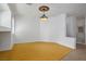 Spacious living room features wood floors, large windows, and a decorative light fixture at 10513 Shanna Trellis Ave, Las Vegas, NV 89144