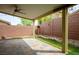 Charming covered patio featuring tile flooring and well-maintained artificial turf at 10513 Shanna Trellis Ave, Las Vegas, NV 89144