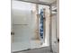 Modern shower with multiple jets and a sliding glass door at 10513 Shanna Trellis Ave, Las Vegas, NV 89144