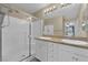 Bright bathroom featuring a large shower, double sinks, and a large mirror at 10973 Sardinia Sands Dr, Las Vegas, NV 89141