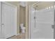 Modern bathroom featuring a glass-enclosed shower and tiled floors at 10973 Sardinia Sands Dr, Las Vegas, NV 89141