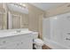 Well-lit bathroom with a white vanity and shower-tub combination at 10973 Sardinia Sands Dr, Las Vegas, NV 89141