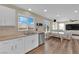 Well-lit kitchen seamlessly connects to the living space creating an inclusive atmosphere for cooking and socializing at 10973 Sardinia Sands Dr, Las Vegas, NV 89141