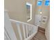 Bright foyer features a staircase with white railings, neutral walls, and carpeted steps at 10973 Sardinia Sands Dr, Las Vegas, NV 89141