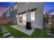 Townhome backyard with faux grass, pavers and outdoor heater at 11325 Gravitation Dr, Las Vegas, NV 89135