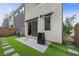 This landscaped backyard boasts faux grass, a heater, and a patio at 11325 Gravitation Dr, Las Vegas, NV 89135