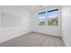 Well-lit bedroom showcasing fresh neutral paint, plush carpet and bright windows at 11325 Gravitation Dr, Las Vegas, NV 89135