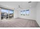 Spacious bedroom with a private balcony and sliding glass doors offers indoor/outdoor living at 11325 Gravitation Dr, Las Vegas, NV 89135