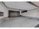Spacious two-car garage featuring epoxy floor and ample built-in storage cabinets along back wall at 11325 Gravitation Dr, Las Vegas, NV 89135