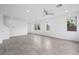 Bright and airy living space with tile flooring, a ceiling fan, and plenty of natural light at 11325 Gravitation Dr, Las Vegas, NV 89135