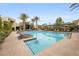 Resort-style pool with lounge chairs and lush landscaping, perfect for relaxation at 11325 Gravitation Dr, Las Vegas, NV 89135