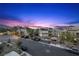 Beautiful street view showcasing modern home designs and desert landscaping at 11325 Gravitation Dr, Las Vegas, NV 89135