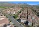 Expansive aerial view of a residential community with mountains in the background on a sunny day at 11334 Colinward Ave, Las Vegas, NV 89135