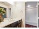 Neutral bathroom shows a white tub/shower combo and a single sink with dark cabinets at 11334 Colinward Ave, Las Vegas, NV 89135