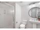 Modern bathroom featuring glass shower, toilet, and pedestal sink at 11334 Colinward Ave, Las Vegas, NV 89135