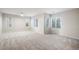 Bright bedroom with neutral carpet, windows, and ceiling fan at 11334 Colinward Ave, Las Vegas, NV 89135
