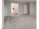 Neutral bedroom leading to bathroom featuring wood floors and glass shower at 11334 Colinward Ave, Las Vegas, NV 89135