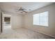 This neutral bedroom offers plush carpet, a ceiling fan, and a window with blinds at 11334 Colinward Ave, Las Vegas, NV 89135