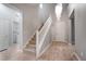 Inviting entryway with wood floors, staircase, and decorative chandelier lighting at 11334 Colinward Ave, Las Vegas, NV 89135