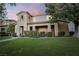 Charming two-story home with a well-manicured lawn and a cozy front porch seating area at 11334 Colinward Ave, Las Vegas, NV 89135