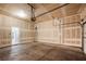 Spacious unfinished garage with concrete floor and open doorway at 11334 Colinward Ave, Las Vegas, NV 89135