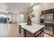 Open-concept design features a kitchen island and stainless steel refrigerator, great for entertaining at 11334 Colinward Ave, Las Vegas, NV 89135