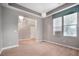 Bright living space with stairs, and a modern, sunlit view of the backyard at 11334 Colinward Ave, Las Vegas, NV 89135
