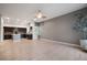 Inviting living area featuring a ceiling fan, and flows into a modern kitchen at 11334 Colinward Ave, Las Vegas, NV 89135