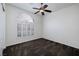 A spacious bedroom is lit with a ceiling fan and a large shuttered window at 1342 Calle Calma, Henderson, NV 89012