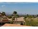 Enjoy amazing city views from this house nestled among palm trees and red tiled roofs at 1342 Calle Calma, Henderson, NV 89012