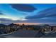 The setting sun on the city skyline viewed from a neighborhood of upscale homes at 1342 Calle Calma, Henderson, NV 89012