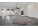 Spacious living room with fireplace, tile and carpet flooring and access to backyard at 1342 Calle Calma, Henderson, NV 89012