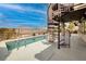 Backyard pool with a spiral staircase leading to a rooftop terrace at 1342 Calle Calma, Henderson, NV 89012