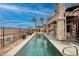 Backyard pool with a spa and patio, and a spiral staircase leading to a rooftop deck with desert views at 1342 Calle Calma, Henderson, NV 89012
